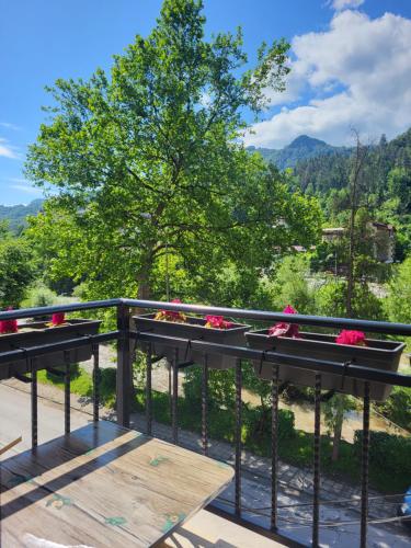 a balcony with a view of a tree and mountains at Luxury apartment in Teteven