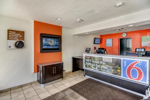 a fast food restaurant with an orange wall at Motel 6-Stockton, CA - North in Lincoln Village
