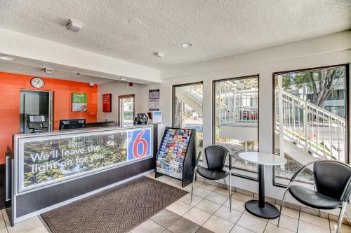 a fast food restaurant with chairs and a counter at Motel 6-Stockton, CA - North in Lincoln Village