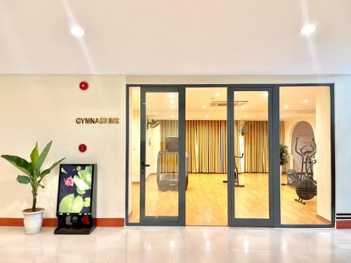 a lobby with sliding glass doors in a building at Mondial Hotel Hue in Hue
