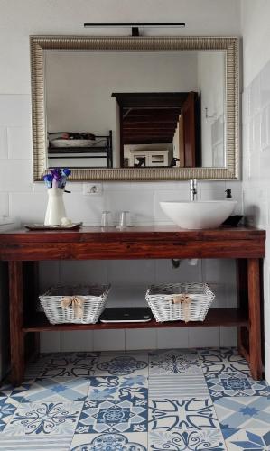 a bathroom with a sink and a mirror at Casa Julián in Garafía