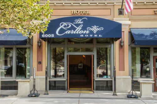 a building with a sign for the canadian store at Carlton Hotel in Atascadero