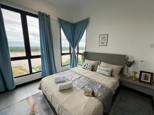 a bedroom with a large bed with a large window at RiverView 8PAX 3BR in KBtown Wi-Fi, B-12-2 in Kota Bharu