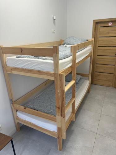 a couple of bunk beds in a room at Gray Hostel Katowice - Parking in Katowice
