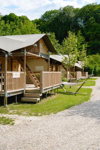 a building with a porch and stairs in front of it at Glamping Valkenburg in Meerssen
