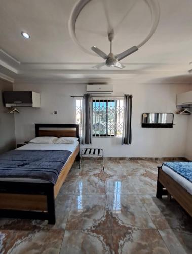 Katil atau katil-katil dalam bilik di BAFFOUR APARTMENTS