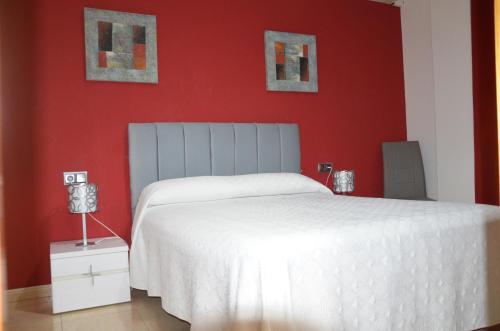 Ένα ή περισσότερα κρεβάτια σε δωμάτιο στο Hostal Mont Royal