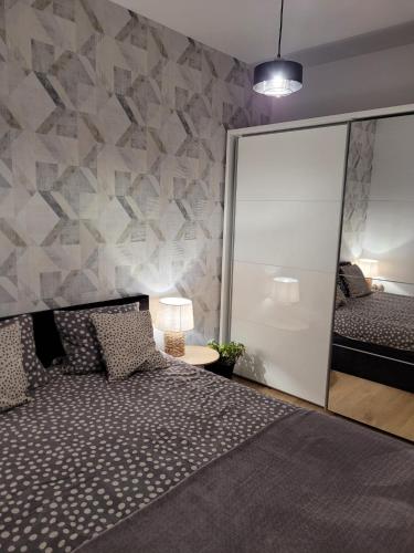 Postel nebo postele na pokoji v ubytování Apartament LILLA 2