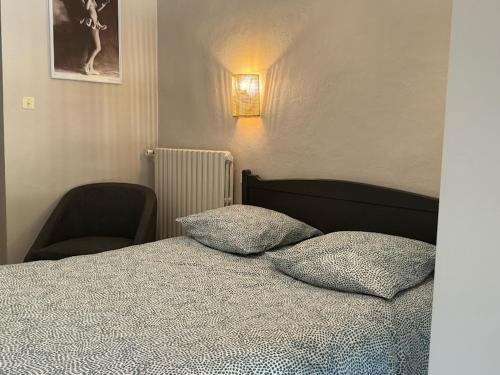 Postel nebo postele na pokoji v ubytování les hyacinthes 1