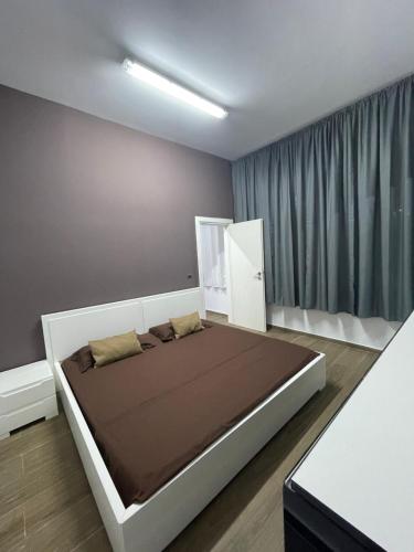 a bedroom with a large bed in a room at Gold apartament vlore free parking in Vlorë