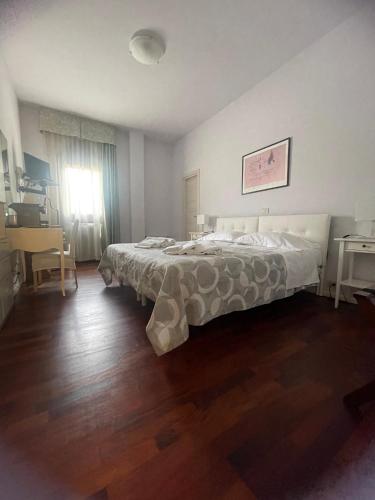 Una cama o camas en una habitación de Hotel L'Approdo