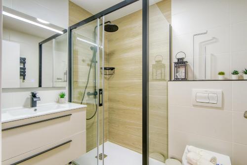 a bathroom with a shower and a sink at Monaco 1A Puerto Roses - Barneda in Roses