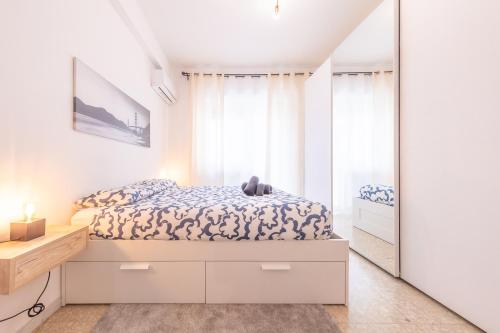 a bedroom with a bed and a mirror at Lungotevere Apartment in Rome