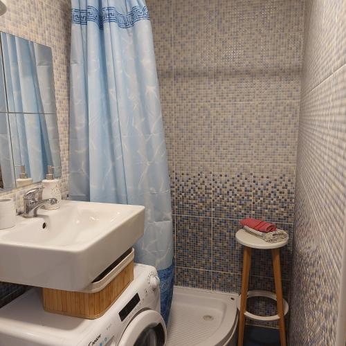 a bathroom with a sink and a toilet at Apartment ADA RB Belgrade in Čukarica