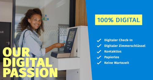 a woman is standing next to a digital display at smartments Mannheim Hauptbahnhof in Mannheim