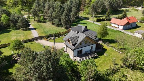 an aerial view of a house in a field at W Otulinie Czerwonej Góry in Chęciny