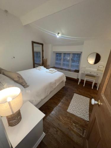 En eller flere senge i et værelse på 40 High street Cottage