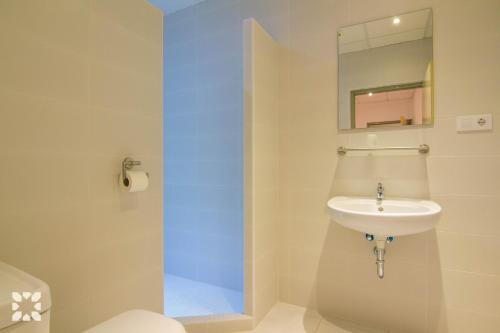 a bathroom with a sink and a mirror at Villa Medina 20 by Abahana Villas in Moraira