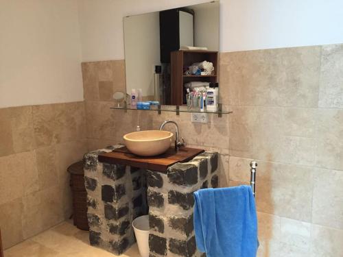 a bathroom with a bowl sink and a mirror at Bunker 35 in Kevelaer