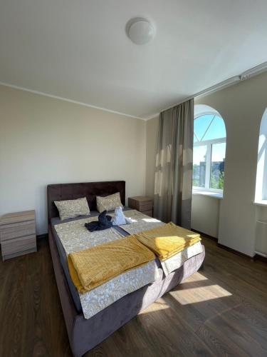 Una cama o camas en una habitación de Baltcity