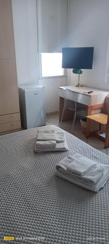 a room with a bed and a desk and a computer at Almaran B&B Trapani port & city in Trapani