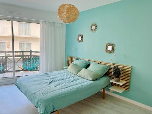 En eller flere senge i et værelse på Un nid au marché à La baule