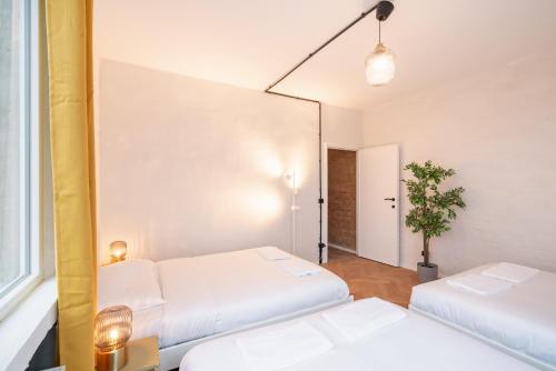 Ένα ή περισσότερα κρεβάτια σε δωμάτιο στο Two-Bedroom Apartments in the Heart of Antwerp