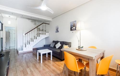 a living room with a table and a couch at 2 Bedroom Awesome Home In Elche in Elche