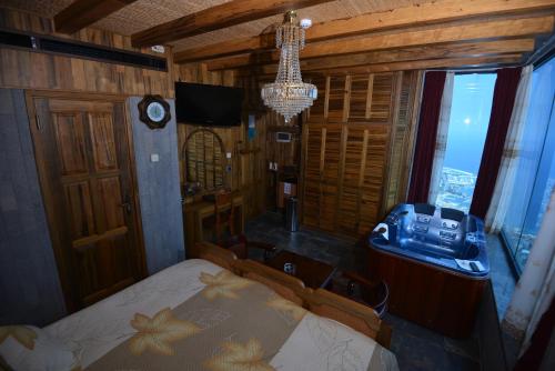 a bedroom with a bed and a sink and a window at Bay Lodge Boutique Hotel in Jounieh