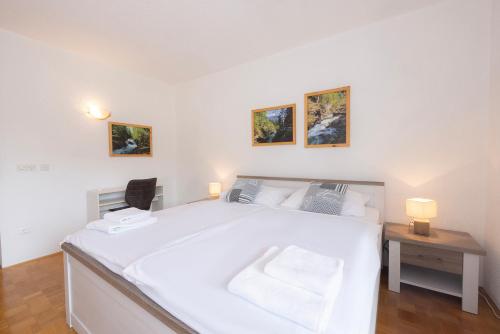 Ένα ή περισσότερα κρεβάτια σε δωμάτιο στο Apartment Panorama & Bella Vista