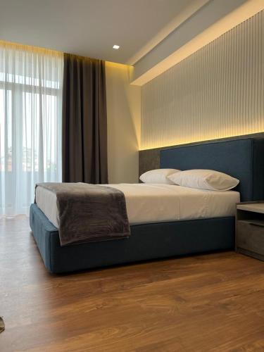 Postel nebo postele na pokoji v ubytování North Alb Hotel