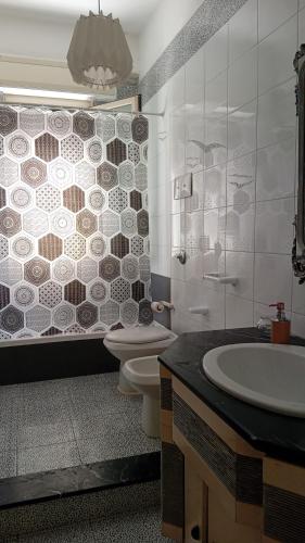 a bathroom with a toilet and a sink and a shower at BBX Palermo Centro in Palermo