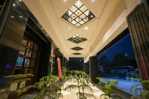 a building with a balcony with plants in it at AR Plaza in Chandīgarh