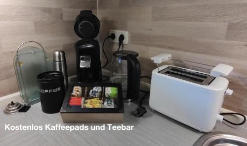 a kitchen counter with a coffee maker and a toaster at Ferienwohnung Katharina I in Alf