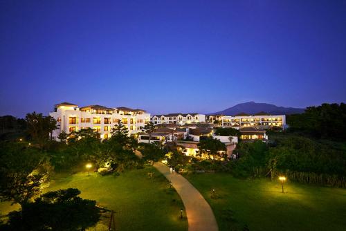a view of a city at night with buildings at Olle Resort in Jeju