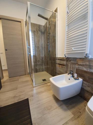 a bathroom with a white sink and a shower at Bergamo - La Casa Di Gianna in Nembro