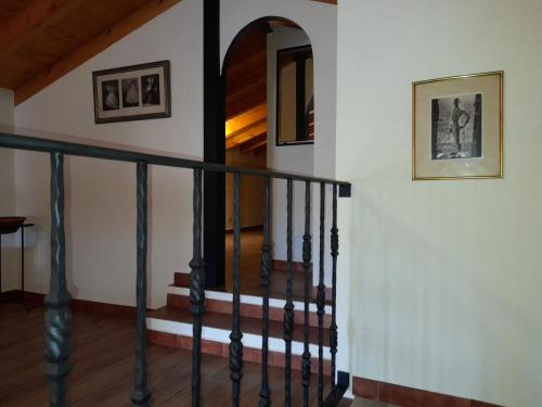 a stairwell in a house with a stair railing at Casa Rural El Brocense - Navamorales in Navamorales