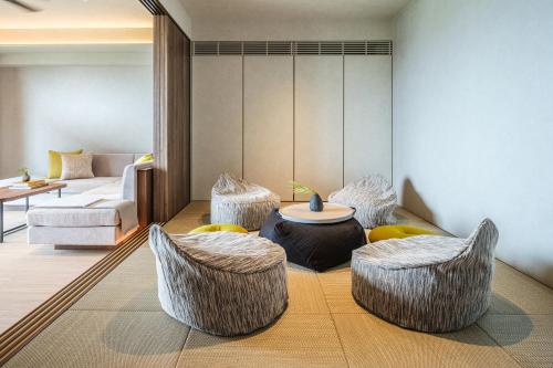 Una cama o camas en una habitación de seven x seven ISHIGAKI
