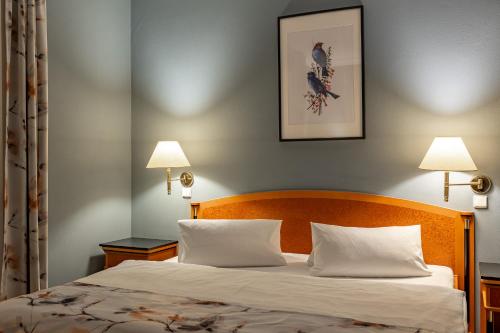 Postel nebo postele na pokoji v ubytování Spa & Wellness Hotel Silva