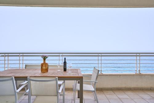 a table and chairs with a view of the ocean at Stunning 3-Bedroom Seaview Retreat in Fort Cambridge in Sliema