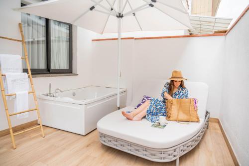 Cama ou camas em um quarto em Neptuno Hotel & SPA 4 Sup