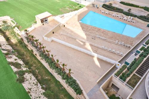 an overhead view of a swimming pool in a house at Stunning 3-Bedroom Seaview Retreat in Fort Cambridge in Sliema