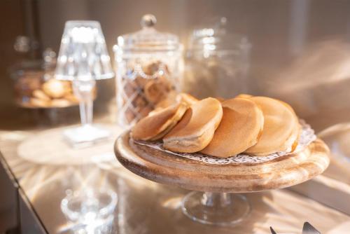 a plate of food sitting on top of a table at Il Pozzo - 1711 Luxury Guest House in Arlate