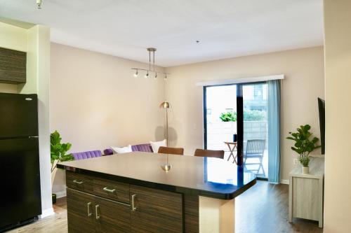 a kitchen with a large island in the middle at Los Angeles Modern Studio in Los Angeles