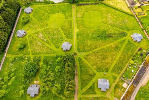 an overhead view of a park with houses and trees at Coot - Exton Park in Exton