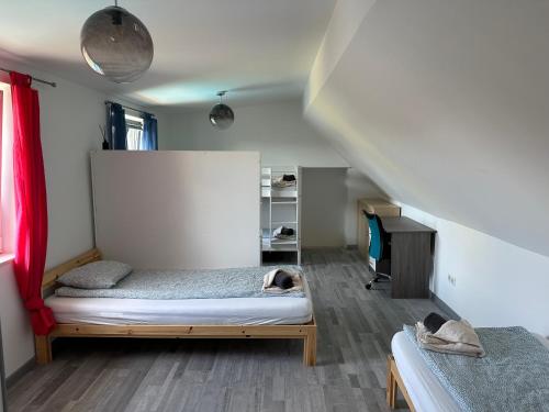 a bedroom with a bed with a dog laying on it at Cozy Apartment next Outlet Center & Airport with Pool & Garden in Parndorf