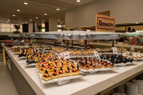 a display case in a store filled with lots of food at Holiday Village Türkiye in Dalaman