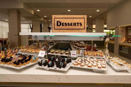 a bakery with many different types of food on display at Holiday Village Türkiye in Dalaman