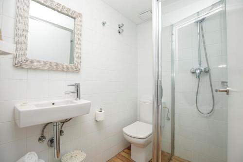 a bathroom with a toilet and a sink and a shower at Hostalet de Cadaques by Suma Hotels in Cadaqués