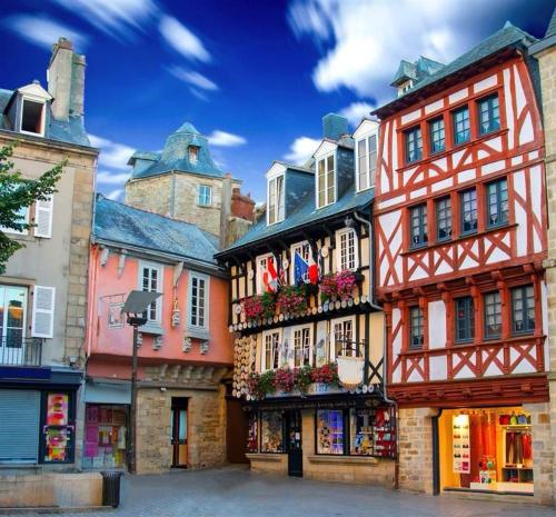 a group of buildings on a city street at Chambre LUXE in Quimper